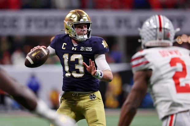 Notre Dame Fighting Irish quarterback Riley Leonard (13) looks to pass the ball.