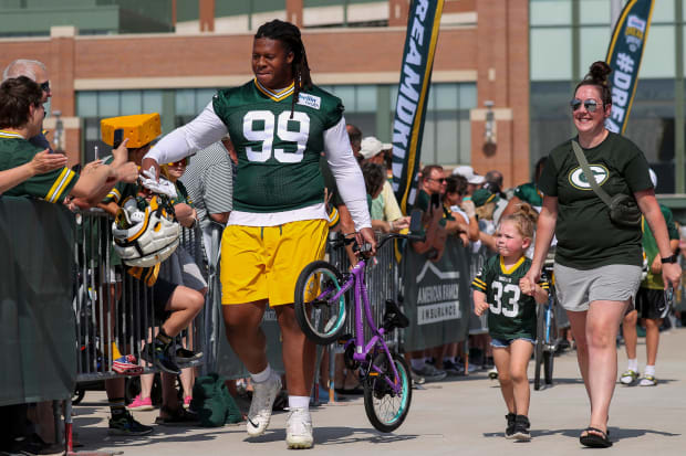 Who needs to ride a bike when you can carry one, like defensive tackle Jonathan Ford.