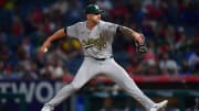 Jul 26, 2024; Anaheim, California, USA;Oakland Athletics pitcher Lucas Erceg (70) throws against the Los Angeles Angelsduring the ninth inning at Angel Stadium. Mandatory Credit: Gary A. Vasquez-USA TODAY Sports
