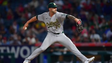 Jul 26, 2024; Anaheim, California, USA;Oakland Athletics pitcher Lucas Erceg (70) throws against the Los Angeles Angelsduring the ninth inning at Angel Stadium. Mandatory Credit: Gary A. Vasquez-USA TODAY Sports