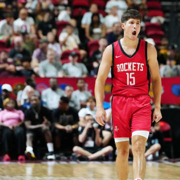 Jul 14, 2024; Las Vegas, NV, USA; Houston Rockets guard Reed Sheppard (15) reacts after scoring against the Washington Wizards during the third quarter at Thomas & Mack Center. Mandatory Credit: Stephen R. Sylvanie-USA TODAY Sports