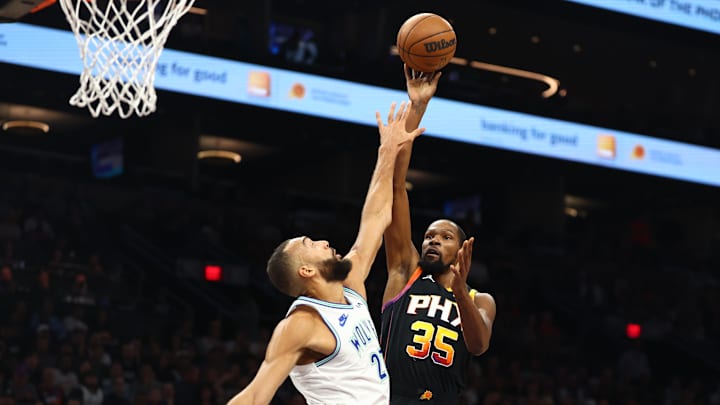 Nov 15, 2023; Phoenix, Arizona, USA; Phoenix Suns forward Kevin Durant (35) shoots the ball against Minnesota Timberwolves center Rudy Gobert (27) in the first half at Footprint Center. Mandatory Credit: Mark J. Rebilas-Imagn Images