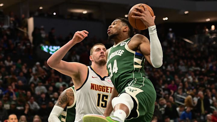 Feb 27, 2025; Milwaukee, Wisconsin, USA; Milwaukee Bucks forward Giannis Antetokounmpo (34) grabs a rebound against Denver Nuggets center Nikola Jokic (15) in the third quarter at Fiserv Forum. Mandatory Credit: Benny Sieu-Imagn Images Feb 27, 2025; Milwaukee, Wisconsin, USA; Milwaukee Bucks forward Giannis Antetokounmpo (34) grabs a rebound against Denver Nuggets center Nikola Jokic (15) in the third quarter at Fiserv Forum. Mandatory Credit: Benny Sieu-Imagn Images