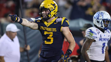 Dec 17, 2024; Frisco, TX, USA; West Virginia Mountaineers wide receiver Hudson Clement (3) reacts after catching a pass against Memphis Tigers defensive back Davion Ross (1) in the fourth quarter at Toyota Stadium. Mandatory Credit: Tim Heitman-Imagn Images