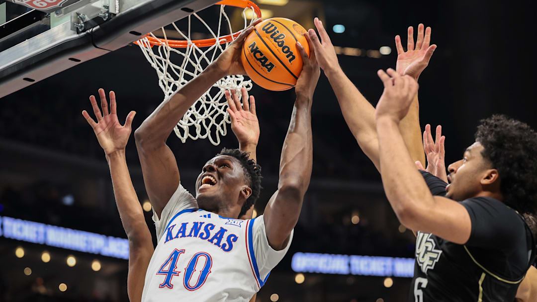 Mar 12, 2025; Kansas City, MO, USA; Kansas Jayhawks forward Flory Bidunga (40) shoots the ball during the first half against the UCF Knights at T-Mobile Center. 