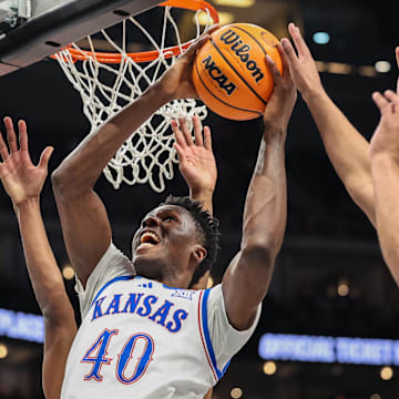 Mar 12, 2025; Kansas City, MO, USA; Kansas Jayhawks forward Flory Bidunga (40) shoots the ball during the first half against the UCF Knights at T-Mobile Center. 
