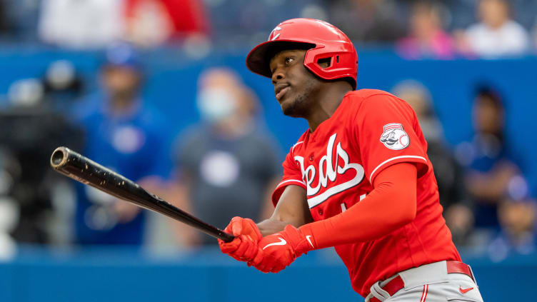 Cincinnati Reds left fielder Aristides Aquino (44) hits a home run.