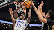 Mar 12, 2025; Kansas City, MO, USA; Kansas Jayhawks forward Flory Bidunga (40) shoots the ball during the first half against the UCF Knights at T-Mobile Center. Mandatory Credit: William Purnell-Imagn Images