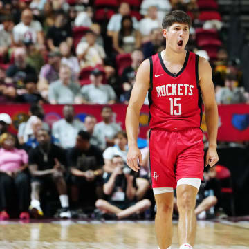 Jul 14, 2024; Las Vegas, NV, USA; Houston Rockets guard Reed Sheppard (15) reacts after scoring against the Washington Wizards during the third quarter at Thomas & Mack Center. Mandatory Credit: Stephen R. Sylvanie-USA TODAY Sports