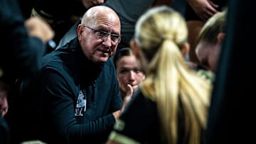 Purdue head coach Dave Shondell huddles up with players in a timeout during a NCAA Big Ten Conference volleyball match