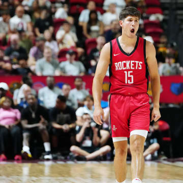 Jul 14, 2024; Las Vegas, NV, USA; Houston Rockets guard Reed Sheppard (15) reacts after scoring against the Washington Wizards during the third quarter at Thomas & Mack Center. Mandatory Credit: Stephen R. Sylvanie-USA TODAY Sports