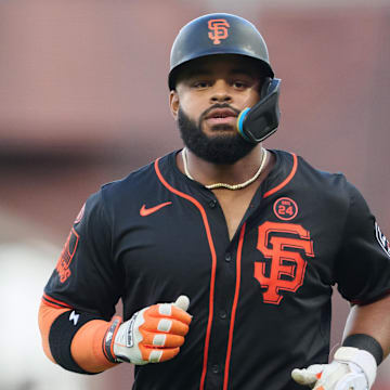 Aug 31, 2024; San Francisco, California, USA; San Francisco Giants outfielder Heliot Ramos (17) runs to the dugout after making an out against the Miami Marlins during the fourth inning at Oracle Park. 