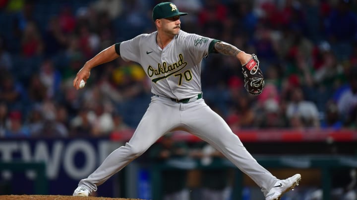 Jul 26, 2024; Anaheim, California, USA;Oakland Athletics pitcher Lucas Erceg (70) throws against the Los Angeles Angelsduring the ninth inning at Angel Stadium. Mandatory Credit: Gary A. Vasquez-USA TODAY Sports