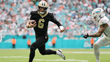 New Orleans Saints QB Tyler Shough (6) is chased down by Miami Dolphins S Ashtyn Davis (21) on Nov.  30., 2025.