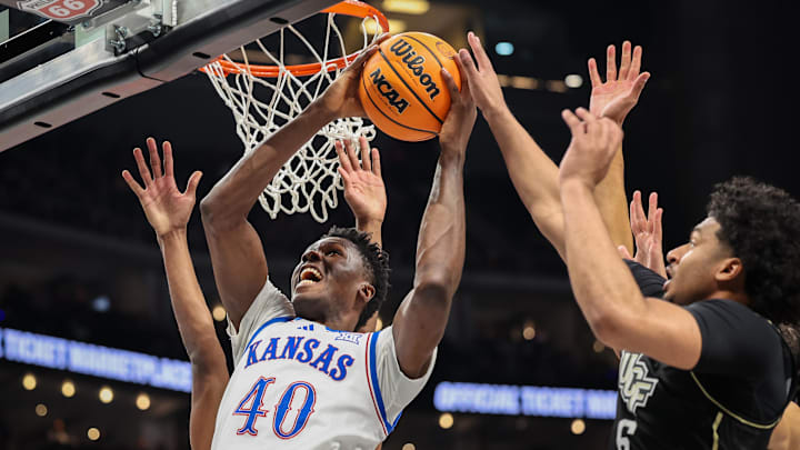 Mar 12, 2025; Kansas City, MO, USA; Kansas Jayhawks forward Flory Bidunga (40) shoots the ball during the first half against the UCF Knights at T-Mobile Center. Mandatory Credit: William Purnell-Imagn Images