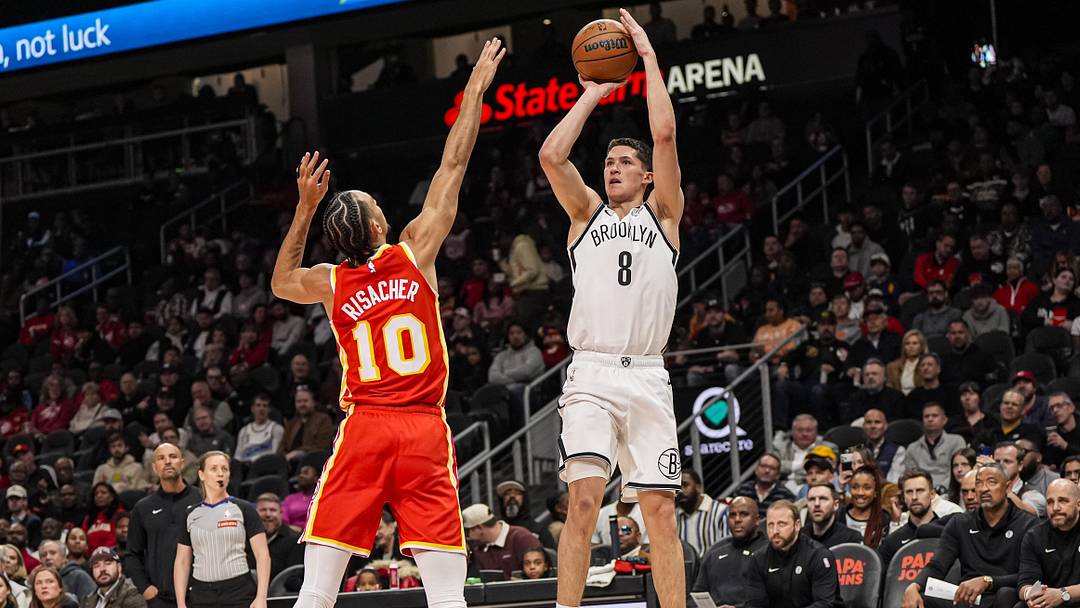Feb 22, 2026; Atlanta, Georgia, USA; Brooklyn Nets guard Egor Demin (8) shoots over Atlanta Hawks forward Zaccharie Risacher (10) during the first half at State Farm Arena. Mandatory Credit: Dale Zanine-Imagn Images
