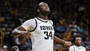 Dec 30, 2024; Iowa City, Iowa, USA; Iowa Hawkeyes forward Chris Tadjo (34) reacts against the New Hampshire Wildcats during the first half at Carver-Hawkeye Arena. Mandatory Credit: Jeffrey Becker-Imagn Images