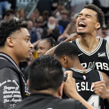 Apr 12, 2024; San Antonio, Texas, USA; San Antonio Spurs forward Victor Wembanyama (1) and teammates react after a victory over the Denver Nuggets at Frost Bank Center. Mandatory Credit: Scott Wachter-Imagn Images