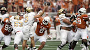 Nov 1, 2025; Austin, Texas, USA; Texas Longhorns linebacker Trey Moore (8) pressures Vanderbilt Commodores quarterback Diego Pavia (2) during the first half  at Darrell K Royal-Texas Memorial Stadium. Mandatory Credit: Scott Wachter-Imagn Images