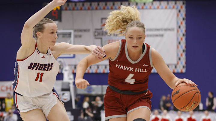 Mar 8, 2025; Henrico, VA, USA; Saint Joseph's Hawks forward Laura Ziegler (4) dribbles the ball as Richmond Spiders forward Anna Camden (11) defends during the second half at Henrico Sports & Events Center. Mandatory Credit: Amber Searls-Imagn Images Mar 8, 2025; Henrico, VA, USA; Saint Joseph's Hawks forward Laura Ziegler (4) dribbles the ball as Richmond Spiders forward Anna Camden (11) defends during the second half at Henrico Sports & Events Center. Mandatory Credit: Amber Searls-Imagn Images