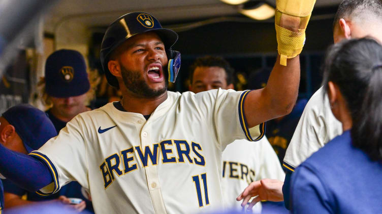 Aug 29, 2024; Milwaukee, Wisconsin, USA; Milwaukee Brewers left fielder Jackson Chourio (11) reacts in the dugout after scoring a run in the fourth inning against the San Francisco Giants at American Family Field. Mandatory Credit: Benny Sieu-USA TODAY Sports