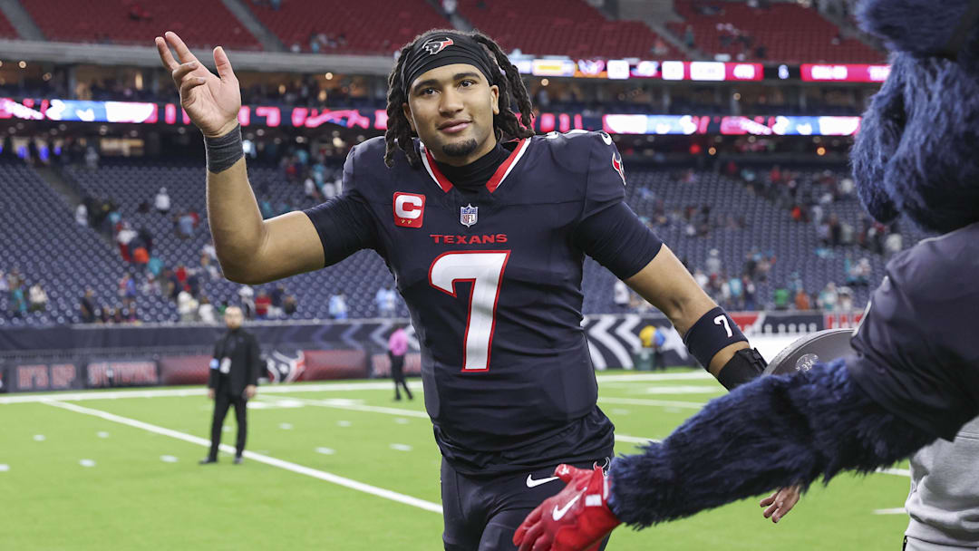 Dec 15, 2024; Houston, Texas, USA; Houston Texans quarterback C.J. Stroud (7) waves while jogging off the field after the game against the Miami Dolphins at NRG Stadium. Mandatory Credit: Troy Taormina-Imagn Images