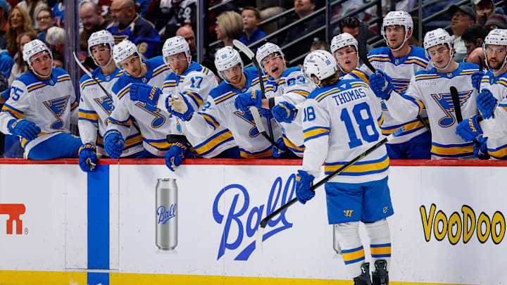 Apr 5, 2026; Denver, Colorado, USA; St. Louis Blues center Robert Thomas (18) celebrates with the bench after his goal in the first period against the Colorado Avalanche at Ball Arena. Mandatory Credit: Isaiah J. Downing-Imagn Images