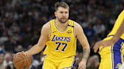 Apr 25, 2025; Minneapolis, Minnesota, USA; Los Angeles Lakers guard Luka Doncic (77) dribbles the ball against the Minnesota Timberwolves during game three of first round for the 2024 NBA Playoffs at Target Center. Mandatory Credit: Jesse Johnson-Imagn Images