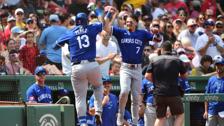 Jul 14, 2024; Boston, Massachusetts, USA;  Kansas City Royals designated hitter Salvador Perez (13) reacts with shortstop Bobby Witt Jr. (7) after hitting a home run during the sixth inning against the Boston Red Sox at Fenway Park. Mandatory Credit: Bob DeChiara-USA TODAY Sports