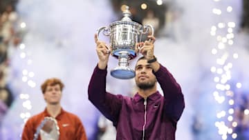 Carlos Alcaraz (ESP) holds the trophy after defeating Jannik Sinner (ITA) in the US Open men's singles final in New York.