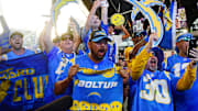  Fans react after Boston College guard Zion Johnson was selected as the sixteenth overall pick to the Los Angeles Chargers during the first round of the 2022 NFL Draft at the NFL Draft Theater. 