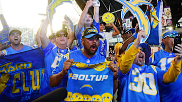  Fans react after Boston College guard Zion Johnson was selected as the sixteenth overall pick to the Los Angeles Chargers during the first round of the 2022 NFL Draft at the NFL Draft Theater. 