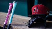 Jun 7, 2023; Washington, District of Columbia, USA; A general view of an Arizona Diamondbacks hat, glove, and bats in the dugout during the fifth inning of the game against the Washington Nationals at Nationals Park. 