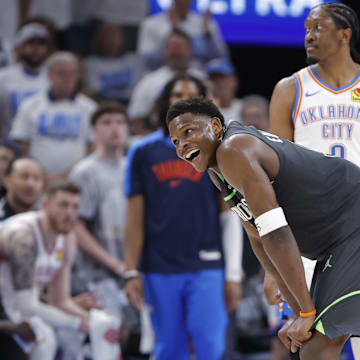 Minnesota Timberwolves guard Anthony Edwards smiles after a foul is called against him.