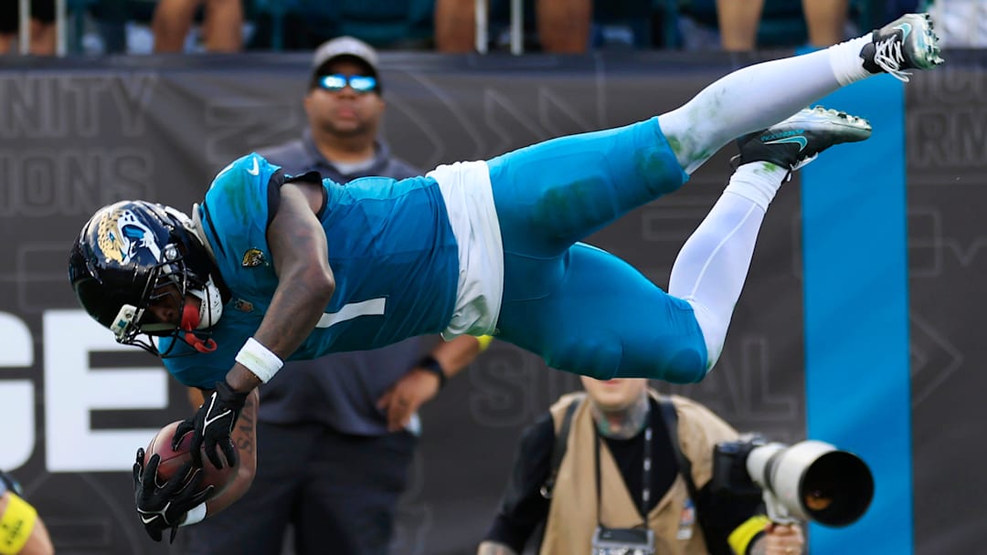 Jacksonville Jaguars running back Travis Etienne Jr. (1) leaps to score a rushing touchdown during the fourth quarter of an NFL football matchup at EverBank Stadium, Sunday, Dec. 14, 2025, in Jacksonville, Fla. The Jaguars defeated the Jets 48-20. [Corey Perrine/Florida Times-Union]