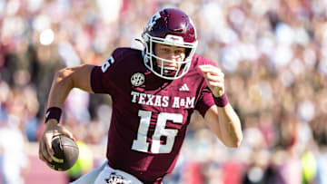 Nov 22, 2025; College Station, Texas, USA; Texas A&M Aggies quarterback Miles O'Neill (16) runs with the ball in the second half of a game at Kyle Field. Mandatory Credit: Joseph Buvid-Imagn Images