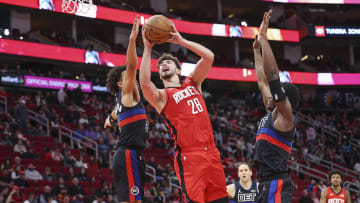 Jan 1, 2024; Houston, Texas, USA; Houston Rockets center Alperen Sengun (28) shoots the ball as Detroit Pistons guard Cade Cunningham (2): Troy Taormina-USA TODAY Sports
