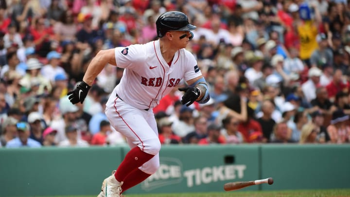 Jul 14, 2024; Boston, Massachusetts, USA;  Boston Red Sox left fielder Tyler O'Neill (17) hits a single during the third inning against the Kansas City Royals at Fenway Park. Mandatory Credit: Bob DeChiara-USA TODAY Sports