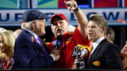 Feb 12, 2023; Glendale, Arizona, US; Fox host Terry Bradshaw (left) interviews Kansas City Chiefs head coach Andy Reid (center) as he celebrates with team owner Clark Hunt and the Vince Lombardi Trophy after winning Super Bowl LVII against the Philadelphia Eagles at State Farm Stadium. Mandatory Credit: Mark J. Rebilas-Imagn Images