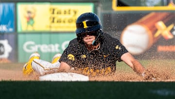 Iowa's Miles Risley slides into third base during game 2 of Iowa vs. Oregon State baseball at Principal Park on May 10, 2025, in Des Moines.