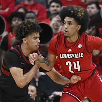 Mar 8, 2025; Louisville, Kentucky, USA;  Louisville Cardinals guard Chucky Hepburn (24) dribbles against Stanford Cardinal guard Oziyah Sellers (4) during the first half at KFC Yum! Center. Louisville defeated Stanford 68-48. Mandatory Credit: Jamie Rhodes-Imagn Images