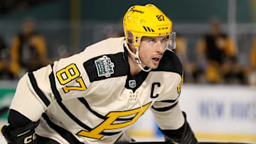 Jan 2, 2023; Boston, Massachusetts, USA; Pittsburgh Penguins center Sidney Crosby (87) during a face-off against the Boston Bruins during the third period of the 2023 Winter Classic ice hockey game at Fenway Park. Mandatory Credit: Paul Rutherford-Imagn Images