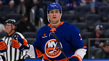 Apr 10, 2025; Elmont, New York, USA;  New York Islanders right wing Maxim Tsyplakov (7) celebrates his power play goal against the New York Rangers during the second period at UBS Arena. Mandatory Credit: Dennis Schneidler-Imagn Images