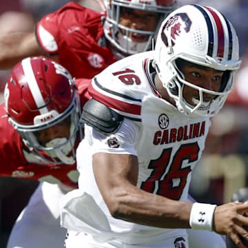 Oct 12, 2024; Tuscaloosa, Alabama, USA;  South Carolina Gamecocks quarterback LaNorris Sellers (16) escapes pressure from the Alabama Crimson Tide as he scrambles during the first half at Bryant-Denny Stadium. Mandatory Credit: Butch Dill-Imagn Images