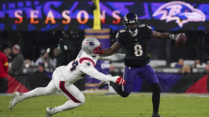 Lamar Jackson left Sunday night's Ravens game against the Patriots with a back injury.