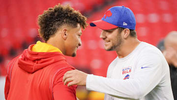 Oct 10, 2021; Kansas City, Missouri, USA; Kansas City Chiefs quarterback Patrick Mahomes (15) talks with Buffalo Bills quarterback Josh Allen (17) before warm ups at GEHA Field at Arrowhead Stadium. Mandatory Credit: Denny Medley-Imagn Images