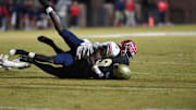 Toombs County cornerback Lagonza Hayward (2) tackles Thomson wide receiver Cervutes Felts (9) during the Thomson and Toombs County playoff game at The Brickyard in Thomson, Ga., on Friday, Nov. 17, 2023. Toombs County defeated Thomson 41-30.