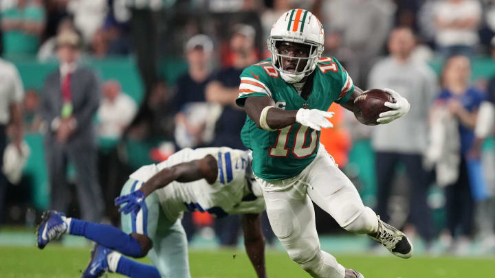 Miami Dolphins wide receiver Tyreek Hill (10) picks up a first down on the Dolphins final drive that lead to a game-winning field goal against the Dallas Cowboys during an NFL game at Hard Rock Stadium in Miami Gardens, Dec. 24, 2023.