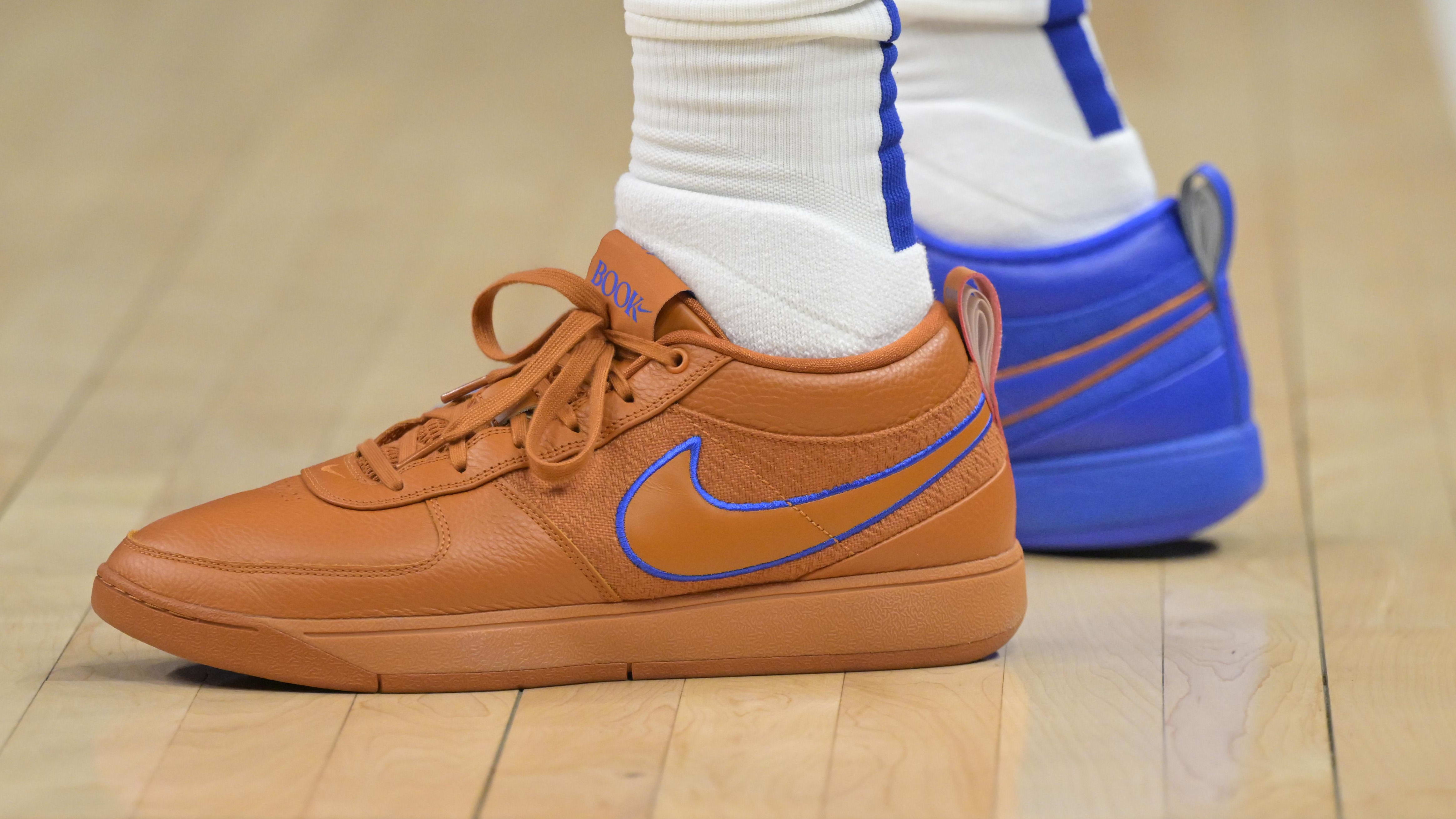 LA Clippers forward P.J. Tucker's orange and blue Nike sneakers.
