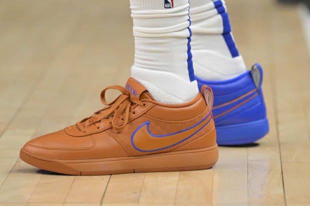 Los Angeles Clippers forward P.J. Tucker's blue and orange Nike sneakers.